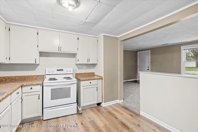 kitchen featuring white cabinets, white electric range oven, and light hardwood / wood-style flooring