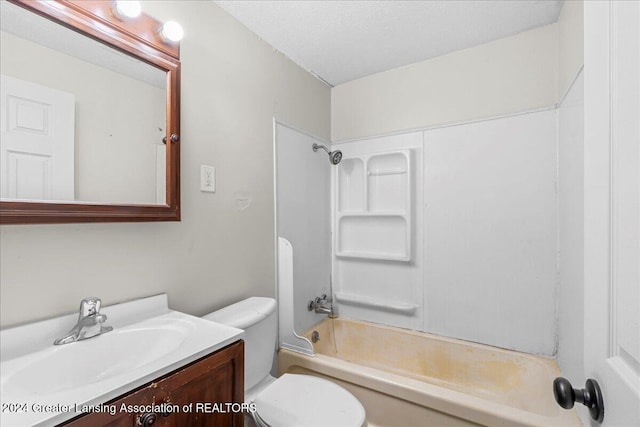 full bathroom featuring vanity, toilet, shower / bath combination, and a textured ceiling