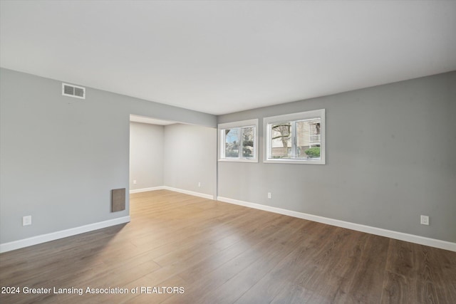 empty room with wood-type flooring