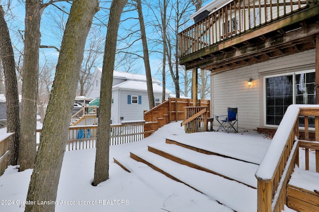 view of snow covered deck