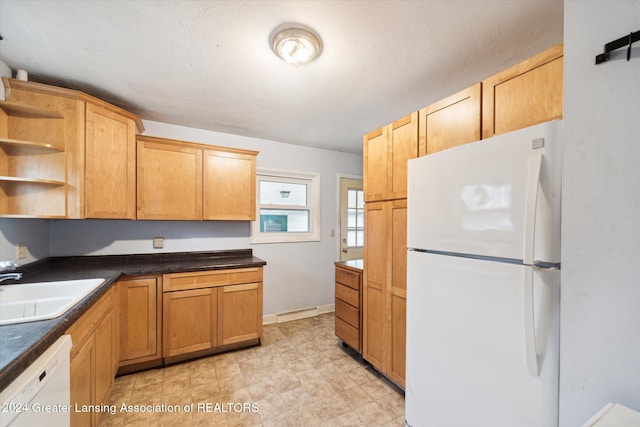 kitchen with white appliances and sink