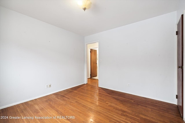 spare room with wood-type flooring