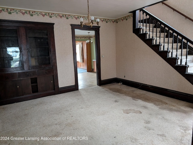 interior space with light carpet and a notable chandelier