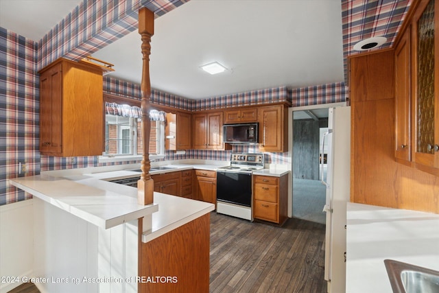 kitchen featuring kitchen peninsula, backsplash, dark wood-type flooring, electric stove, and hanging light fixtures