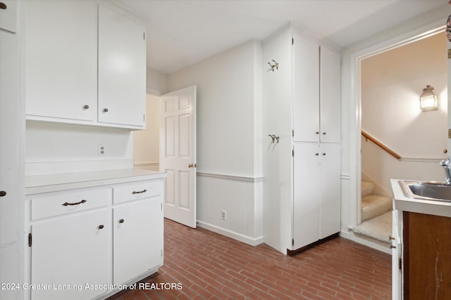 kitchen with white cabinets and sink