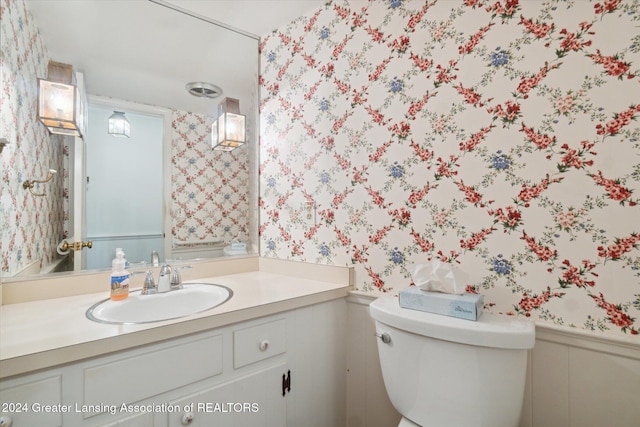 bathroom with vanity and toilet