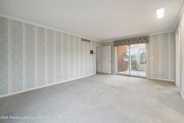 carpeted spare room with ornamental molding