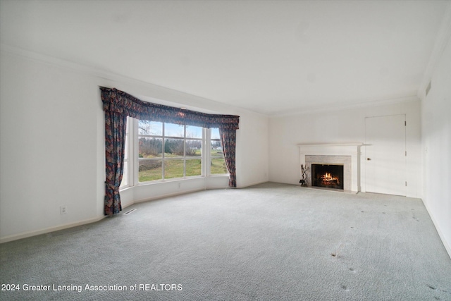 unfurnished living room with carpet and crown molding