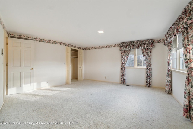 unfurnished bedroom with carpet