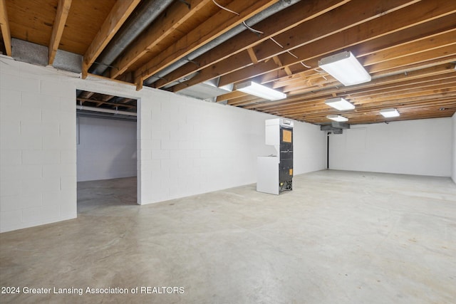 basement featuring heating unit