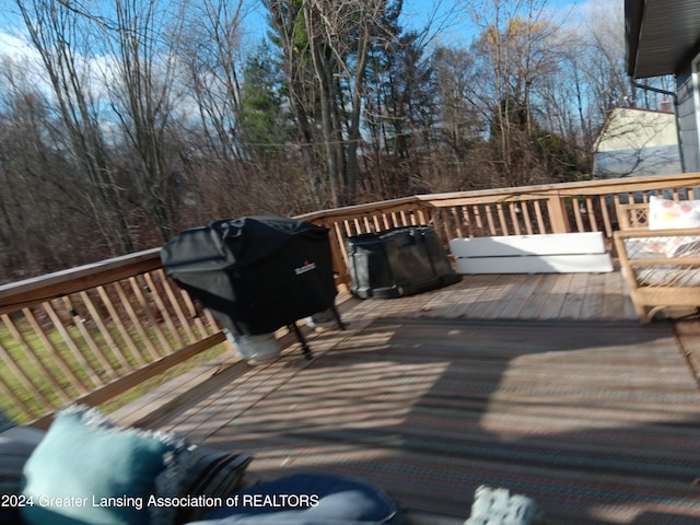 wooden terrace featuring area for grilling