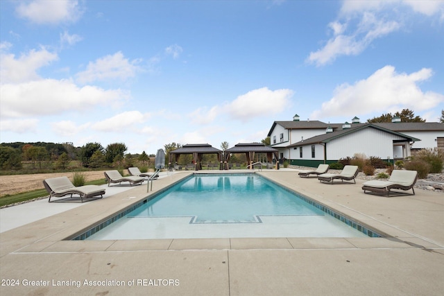 view of swimming pool featuring a patio area