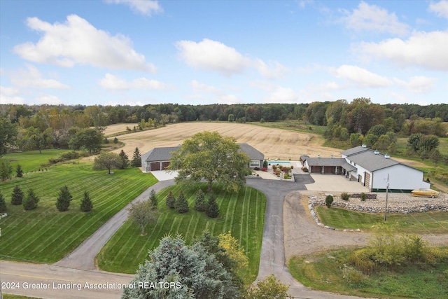 birds eye view of property with a rural view