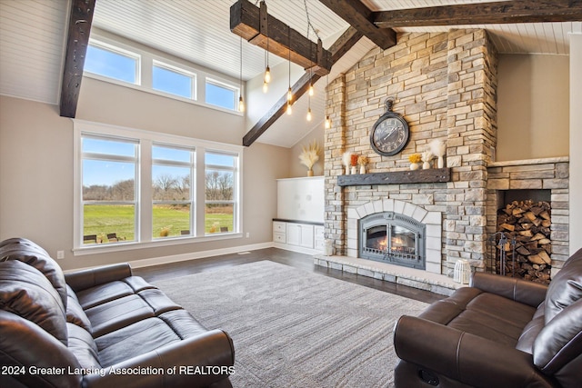 living room featuring a fireplace, hardwood / wood-style floors, high vaulted ceiling, and beamed ceiling