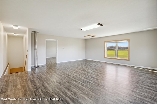 unfurnished room with dark hardwood / wood-style floors