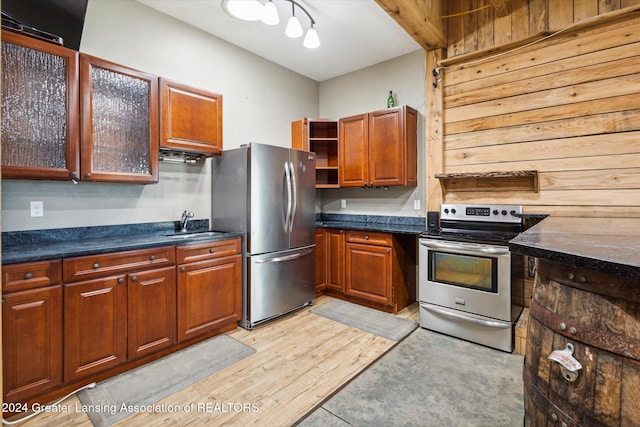 kitchen featuring light hardwood / wood-style floors, sink, and stainless steel appliances