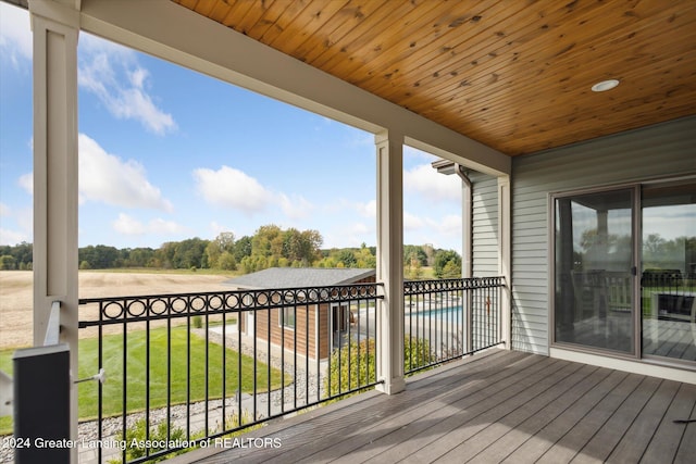 wooden terrace featuring a rural view