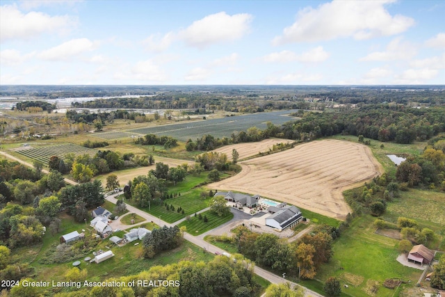 birds eye view of property with a rural view