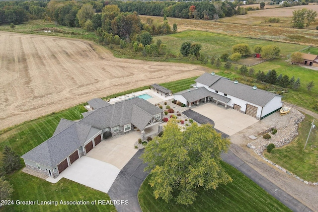 birds eye view of property with a rural view