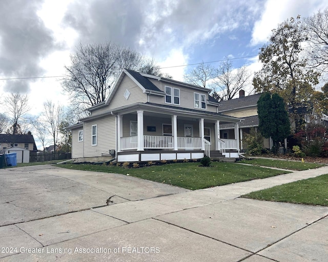 view of front of house with a front lawn and a porch