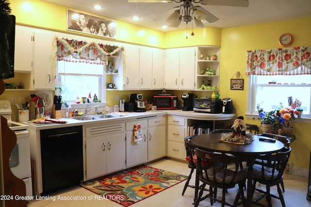 kitchen with black appliances, plenty of natural light, white cabinetry, and sink