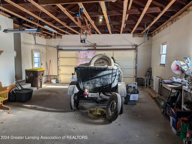 garage featuring a garage door opener