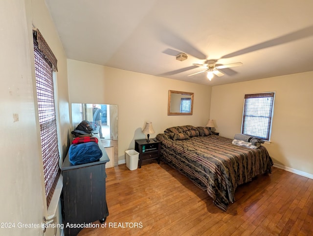 bedroom featuring wood-type flooring and ceiling fan