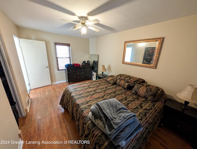 bedroom featuring wood-type flooring and ceiling fan