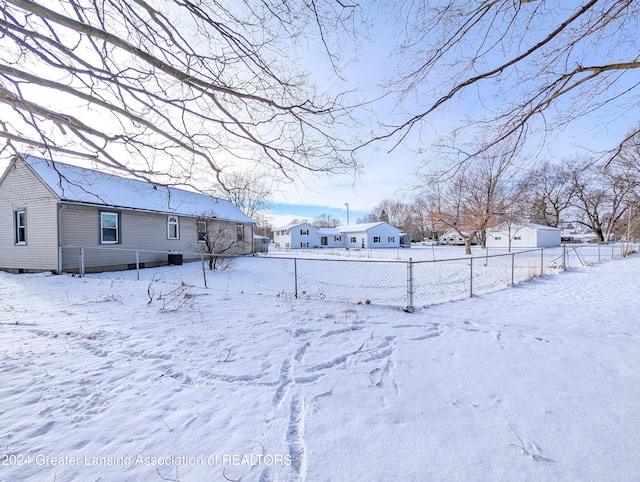 view of yard covered in snow