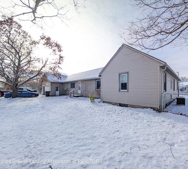 view of snow covered house