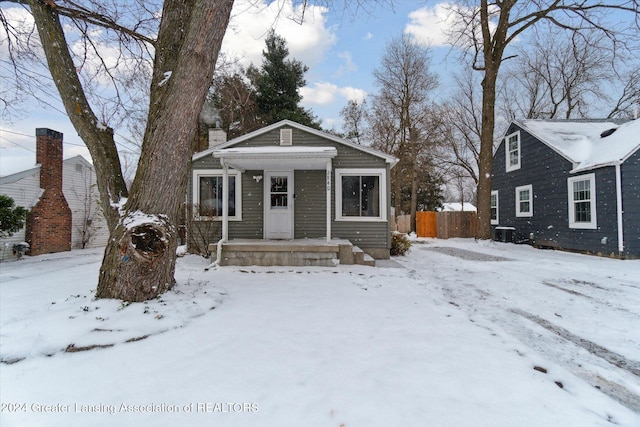 bungalow-style house featuring central air condition unit