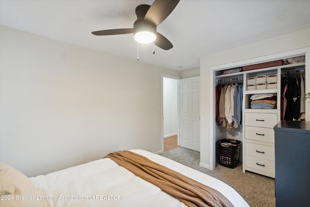 carpeted bedroom featuring a closet and ceiling fan