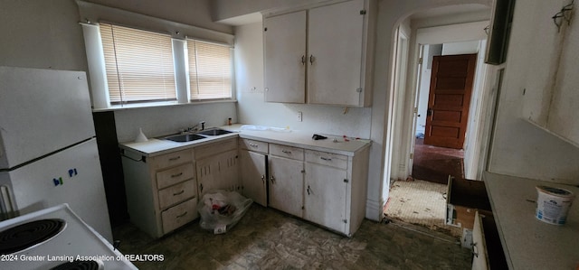 kitchen featuring white fridge and sink