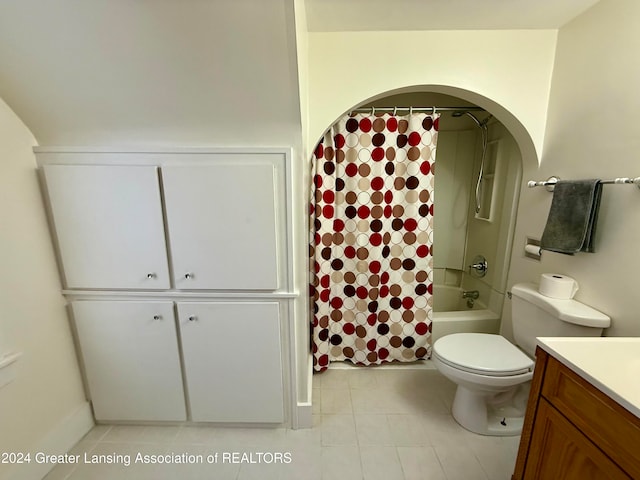 full bathroom with toilet, vanity, tile patterned floors, and shower / bath combo with shower curtain