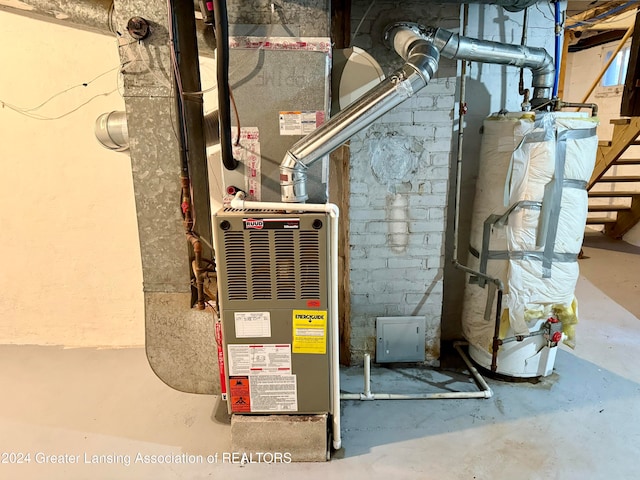 utility room with gas water heater