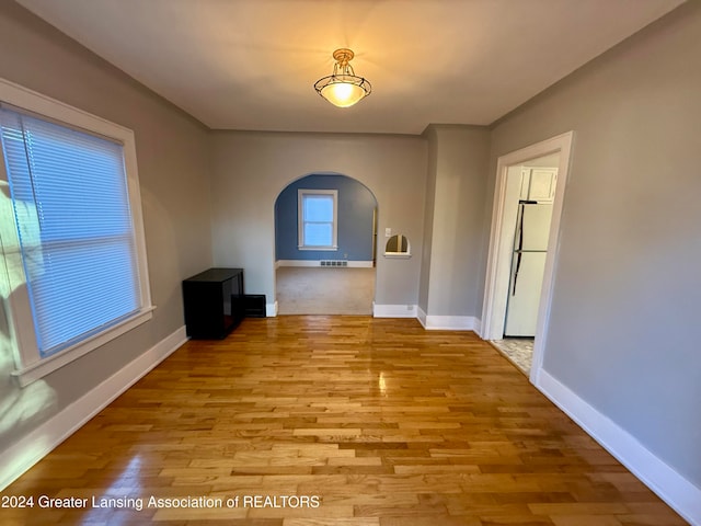 unfurnished room with light hardwood / wood-style floors