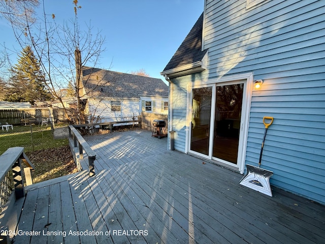 wooden deck featuring area for grilling