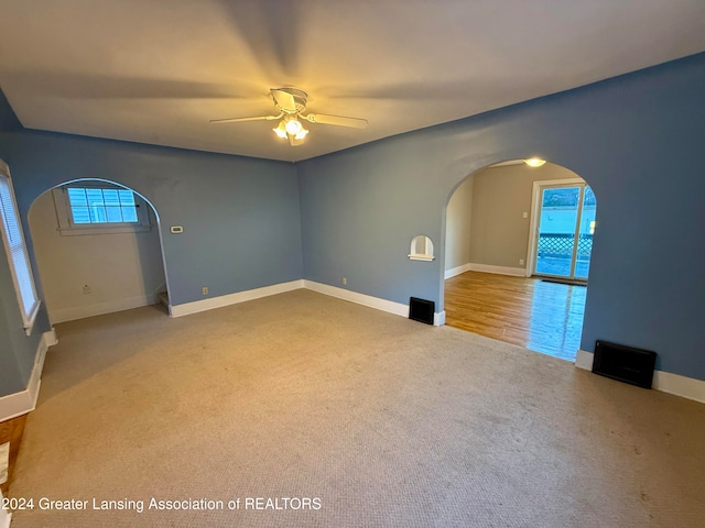 spare room with ceiling fan and carpet floors