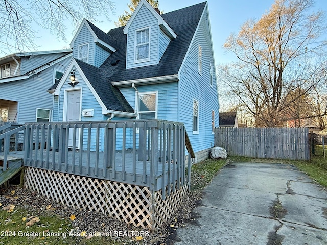 back of house with a wooden deck