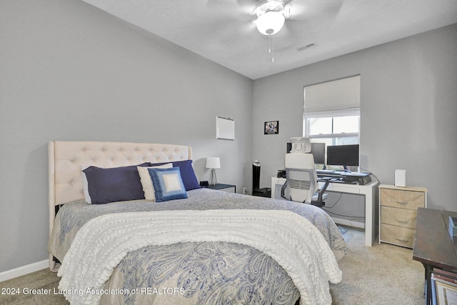 bedroom with carpet flooring, baseboards, visible vents, and ceiling fan