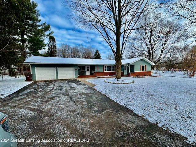 single story home featuring a garage