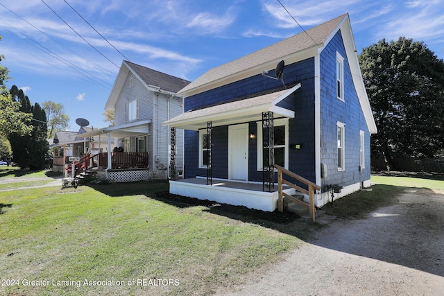 view of front of property with a front lawn and a porch