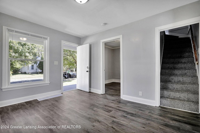 spare room featuring dark hardwood / wood-style floors