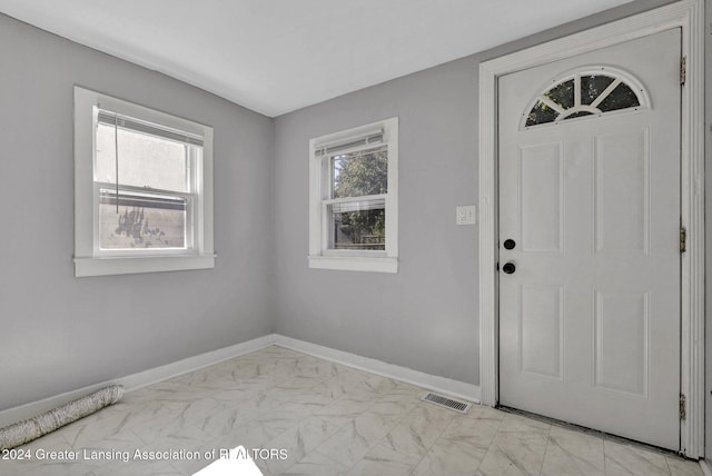 foyer entrance with plenty of natural light