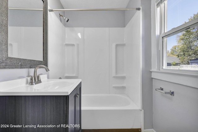 bathroom featuring vanity and shower / bathtub combination