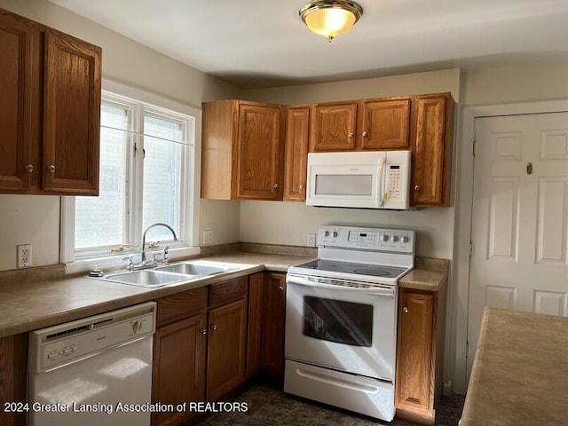 kitchen with white appliances and sink