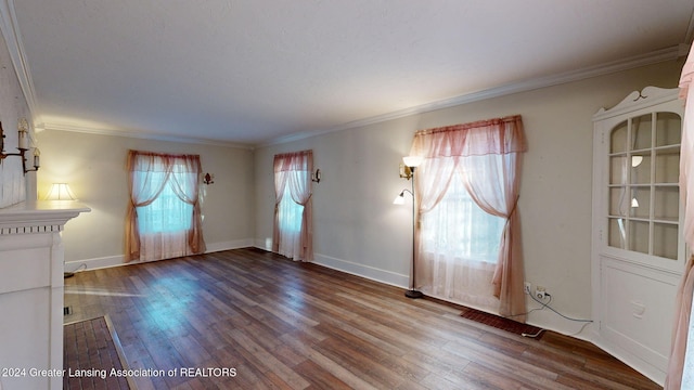 unfurnished room featuring hardwood / wood-style floors and ornamental molding