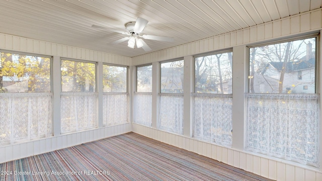 unfurnished sunroom featuring plenty of natural light