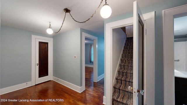 entryway with dark hardwood / wood-style floors