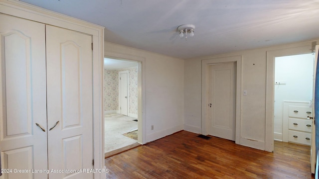 unfurnished bedroom featuring dark wood-type flooring